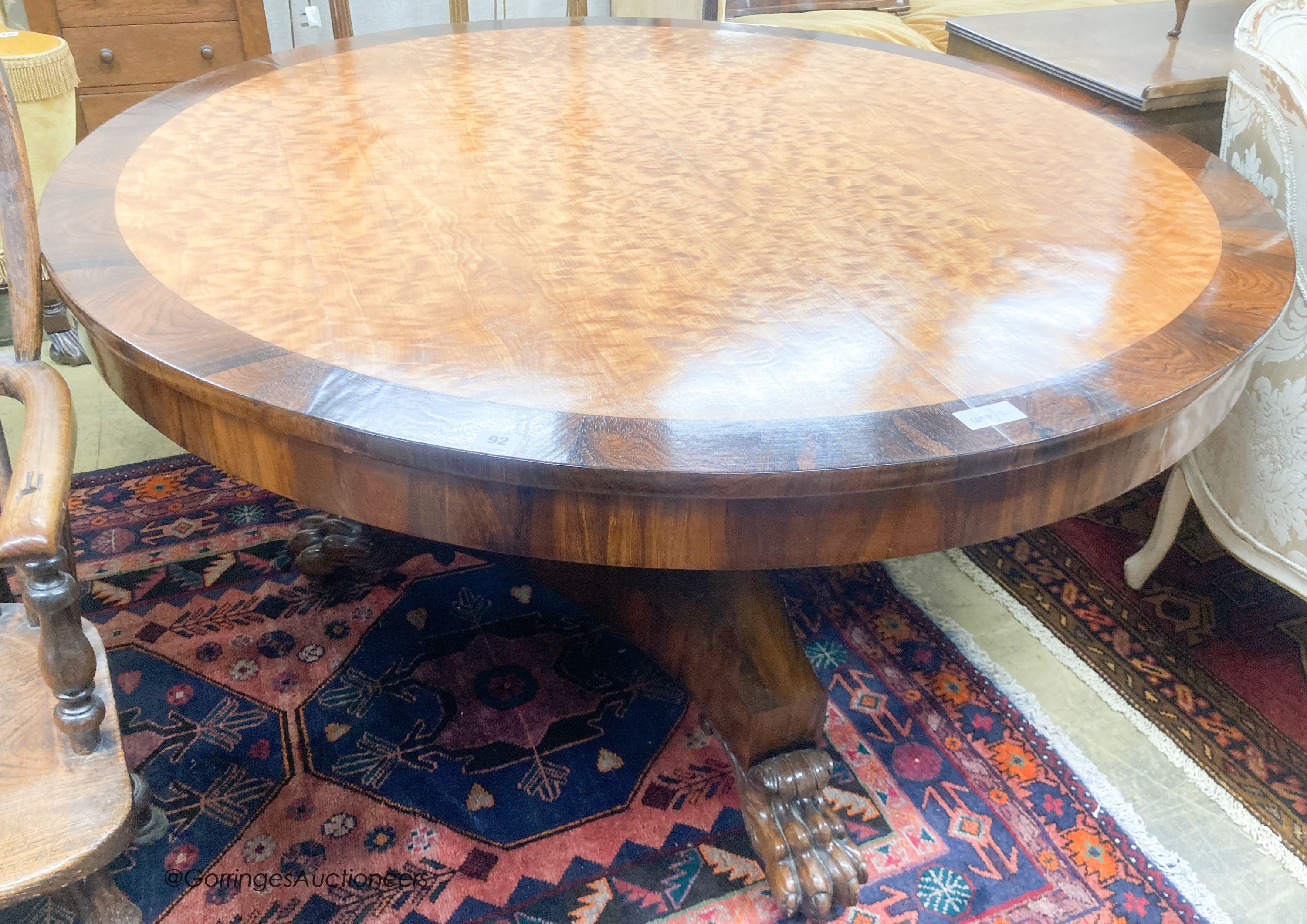 A George IV and later mahogany and satinwood circular tilt top breakfast table, diameter 138cm, height 76cm
